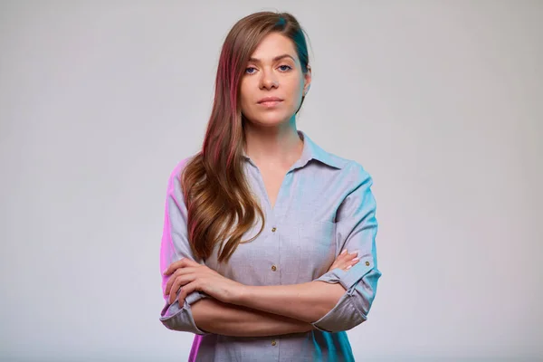 Young confident business woman arms crossed, isolated portrait.