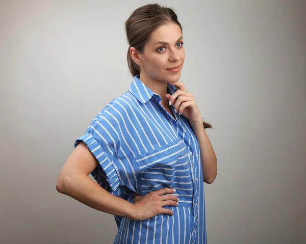 Young woman in casual blue over size  dress isolated portrait.