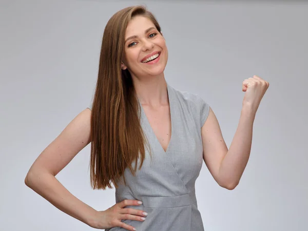 Woman power concept pose. Smiling business woman bends her arm, demonstrating her feminine strength. isolated portrait.