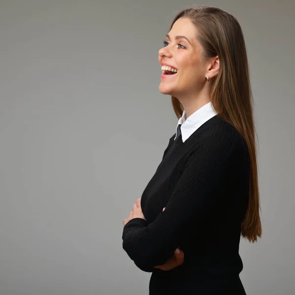 Profile of laughing woman teacher in black business suit with white collar, isolated female portrait.