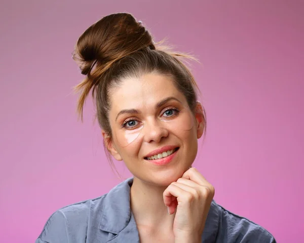 Smiling Woman Eyes Patches Touching Her Chin Isolated Pink Female — Stock Photo, Image