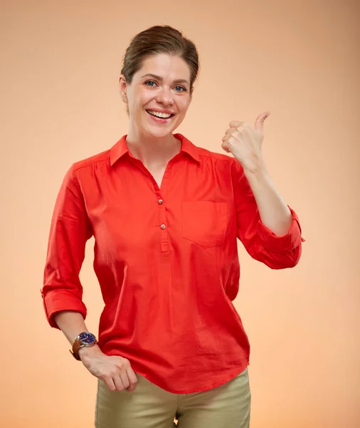 Smiling Woman Red Shirt Doing Thumb Isolated Yellow Beige Background — Stock Photo, Image