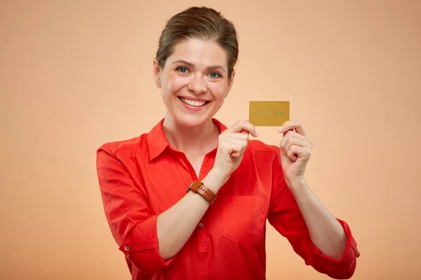 Isolated portrait of smiling business woman holding credit card.