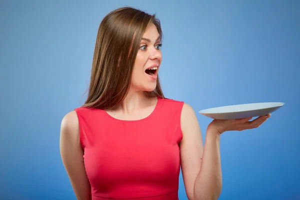 Surprising Woman Red Dress Holding Empty Plate Isolated Female Person — Stock Photo, Image