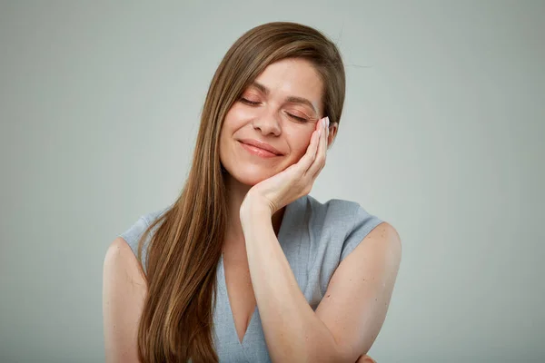 Dreaming thinking young woman with eyes closed. isolated portrait.