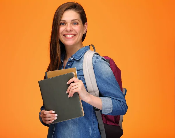 Joven Estudiante Con Mochila Sosteniendo Libros Retrato Aislado Espalda Naranja — Foto de Stock