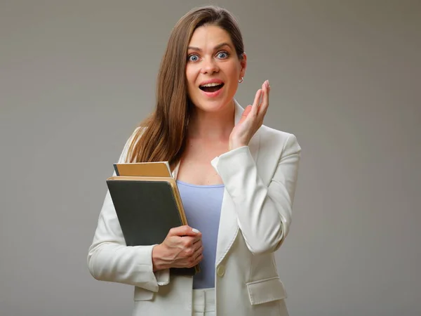 Young Surprising Woman White Suit Holding Books Studio Isolated Portrait — Stock Photo, Image