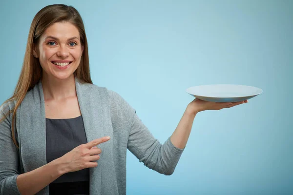Smiling Woman Holding Empty Plate Pointing Finger Isolated Portrait — Stock Photo, Image