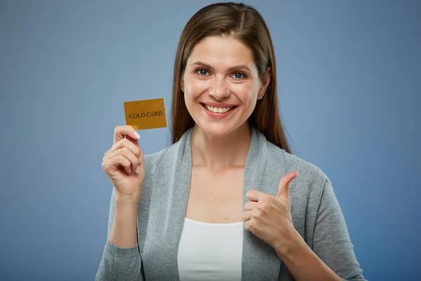 Woman with credit card and thumb up isolated portrait.