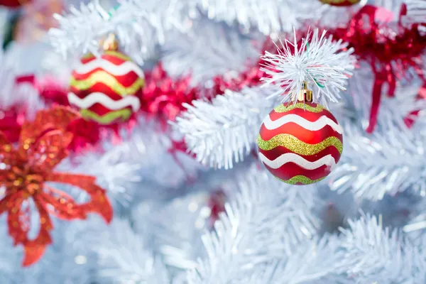 Christmas red balls and decorations on white Christmas tree — Stock Photo, Image