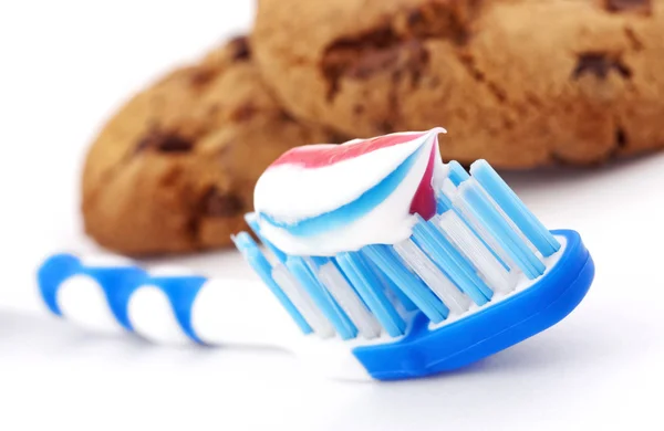 Toothbrush and cakes — Stock Photo, Image