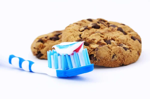 Toothbrush and cakes — Stock Photo, Image
