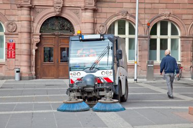 Frankfurt am Main.Cleaning up of streets clipart