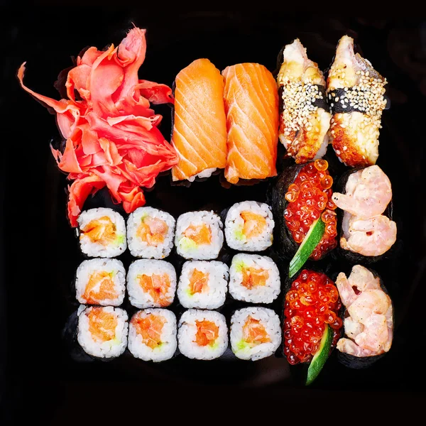 Set of sushi on a black plate — Stock Photo, Image