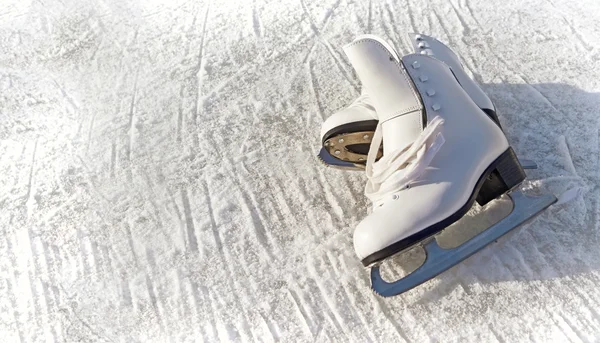 Women white skates. Abstract background on a winter sports theme — Stock Photo, Image