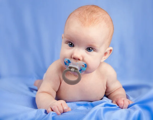 Baby girl with dummy — Stock Photo, Image