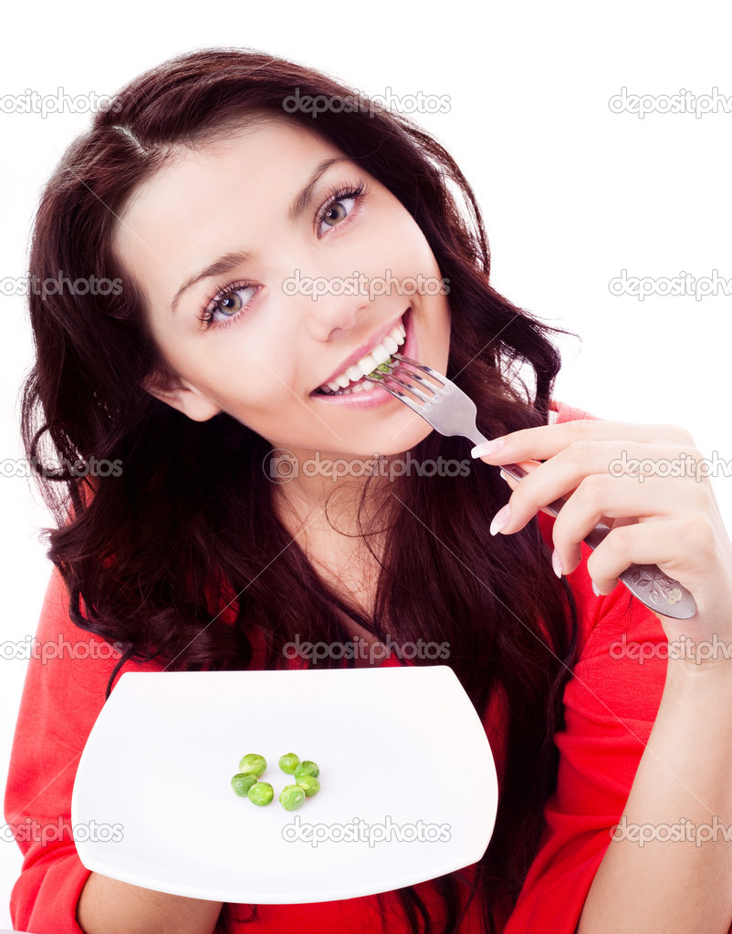 Woman eating peas
