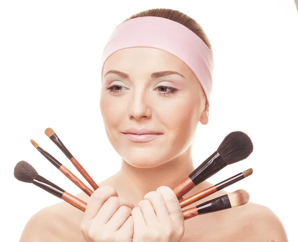 Young woman with brushes — Stock Photo, Image