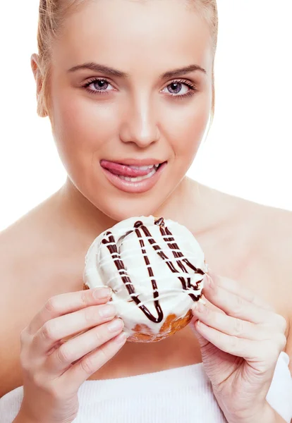 Woman eating a bun Stock Image