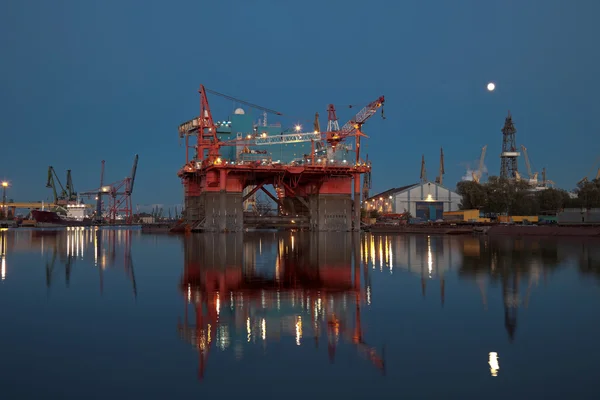 Oil rig at night Stock Photo