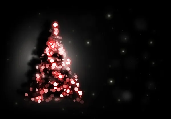 Різдвяна ялинка, що сяє на чорному тлі — стокове фото