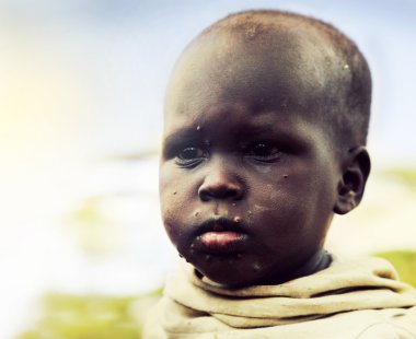 Poor young child portrait. Tanzania, Africa clipart