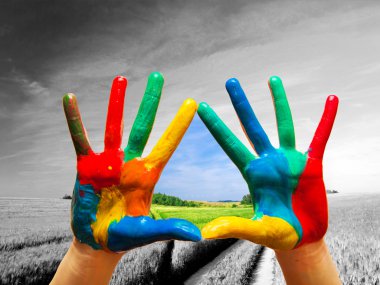 Painted colorful hands showing way to colorful happy life clipart