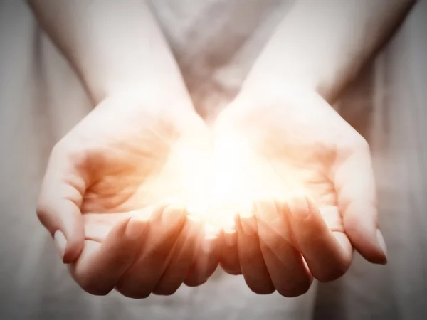 The light in young woman hands — Stock Photo, Image