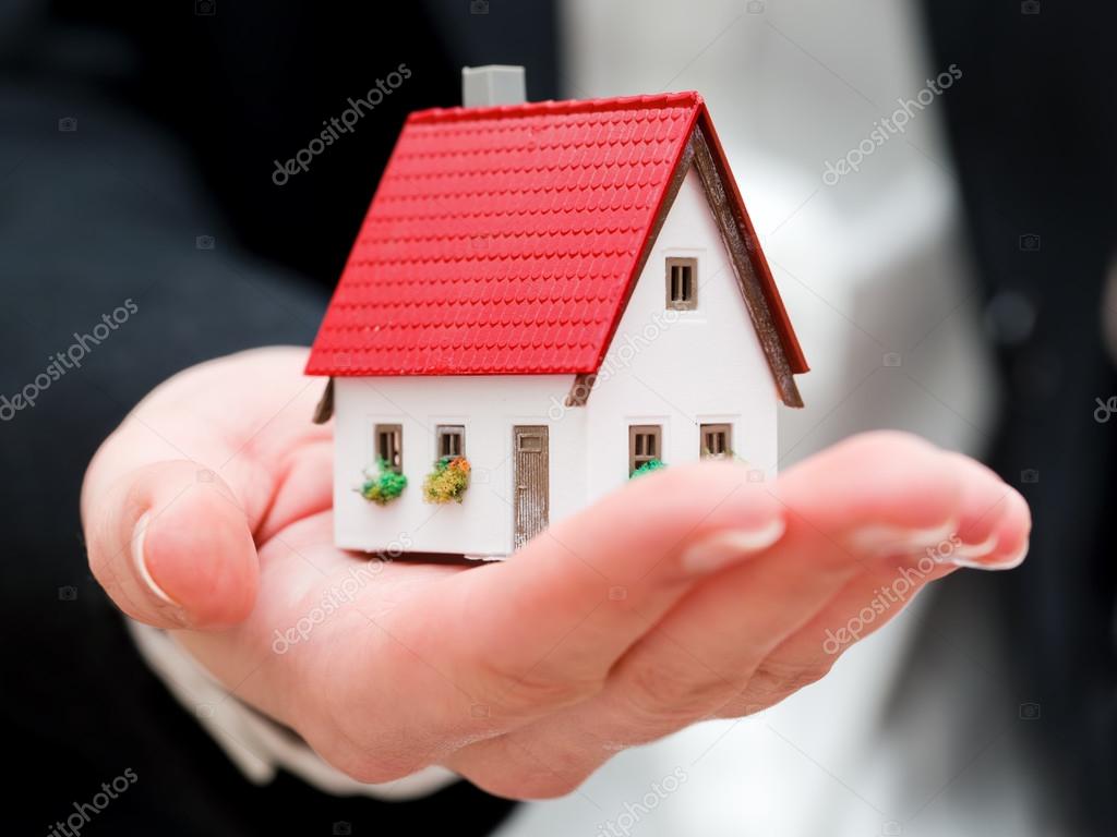Real estate agent holding a small new house Stock Photo by ©Photocreo 45579841 Real estate agent holding a small new house Stock Photo by ©Photocreo 45579841