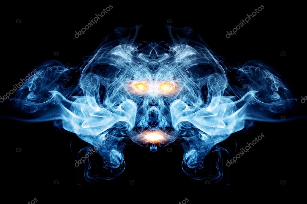 Abstract face made of smoke, flames. May be the concept of ghost, devil, logo element, background