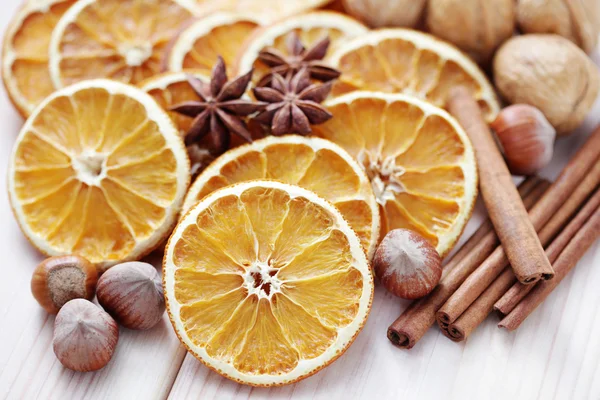 Dry oranges with walnut and cinnamon — Stock Photo, Image