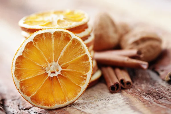 Dry oranges with walnut and cinnamon — Stock Photo, Image