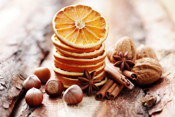 Dry oranges with walnut and cinnamon — Stock Photo, Image