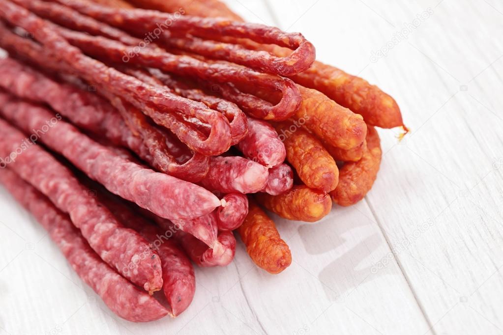 Long dry sausages — Stock Photo © matka_Wariatka 44608621