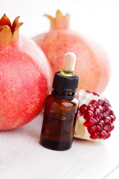 Pomegranate essential oil — Stock Photo, Image