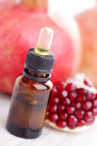 Pomegranate essential oil — Stock Photo, Image