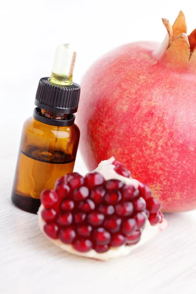 Pomegranate essential oil — Stock Photo, Image