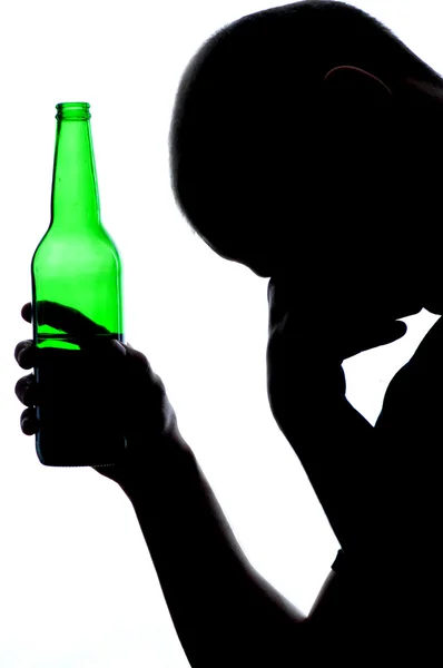 Silhouette of man drinking alcohol Stock Picture