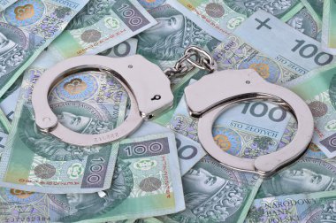 hancuffs ve arka planda banknot
