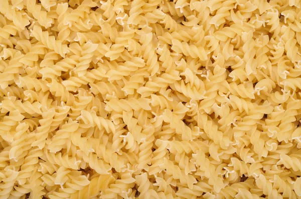 Fusilli pasta background — Stock Photo, Image
