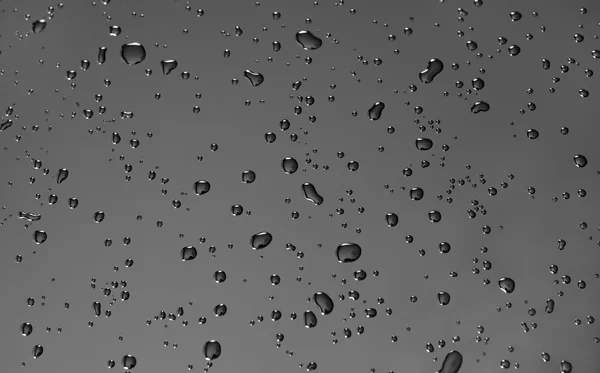 Fundo fresco de gotas de água na superfície preta — Fotografia de Stock