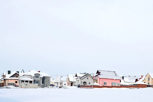 Zimní krajina s různými domy — Stock fotografie