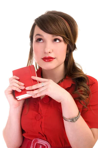 Girl in red dress and her diary — Stock Photo, Image