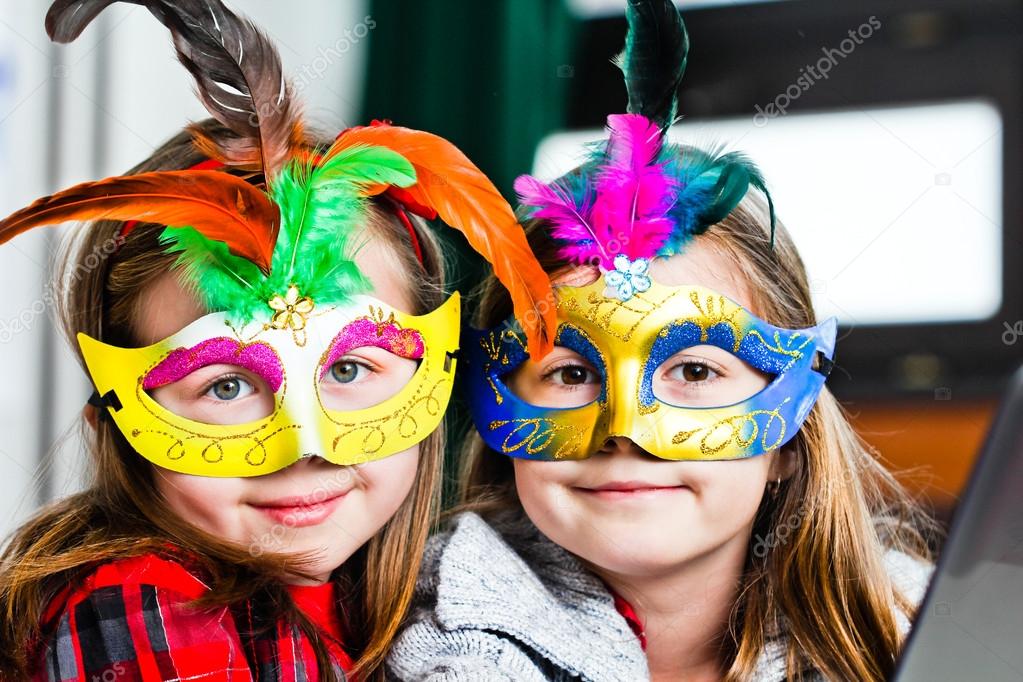 Two funny little girls with masks — Stock Photo © muhammed 13756742