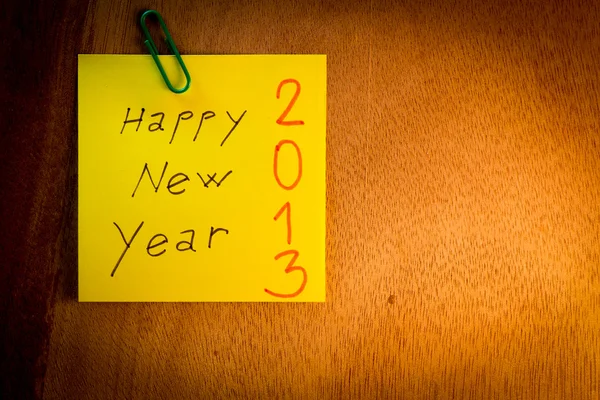 Paper notes with Happy New Year and Merry Christmas — Stock Photo, Image