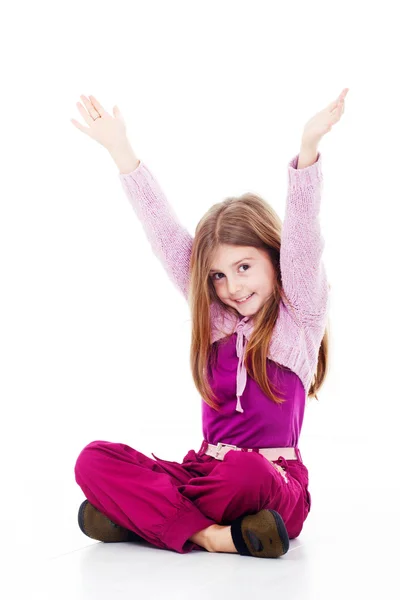 Happy little girl sitting on floor — Stock Photo, Image