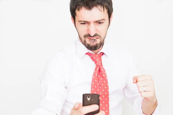 Verrast zakenman met een telefoon — Stockfoto