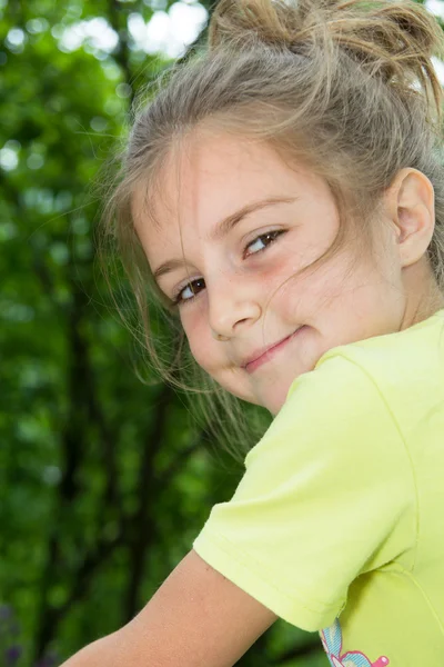 Beautiful little girl on a bicycle — Stock Photo, Image