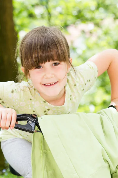 Beautiful little girl on a bicycle — Stock Photo, Image