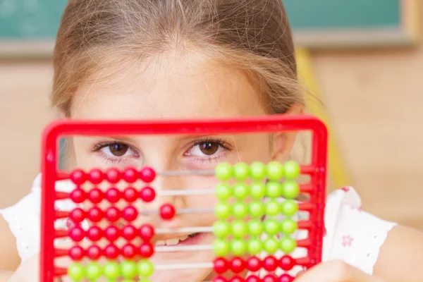 Schoolgirl in the clasroom - back to school — Stock Photo, Image